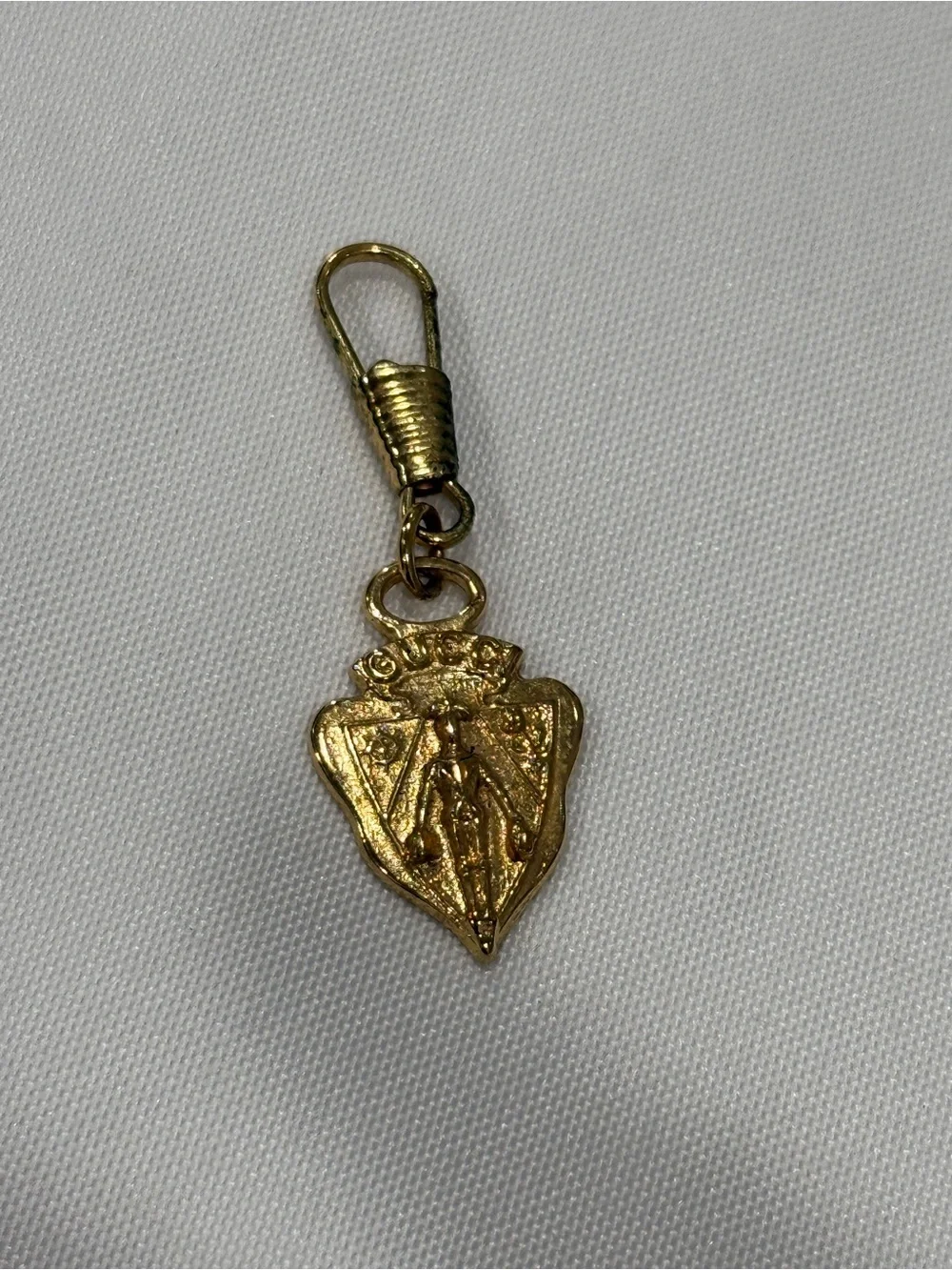 Gucci Gold Tone Shield Charm Zipperpull- Women Accessories